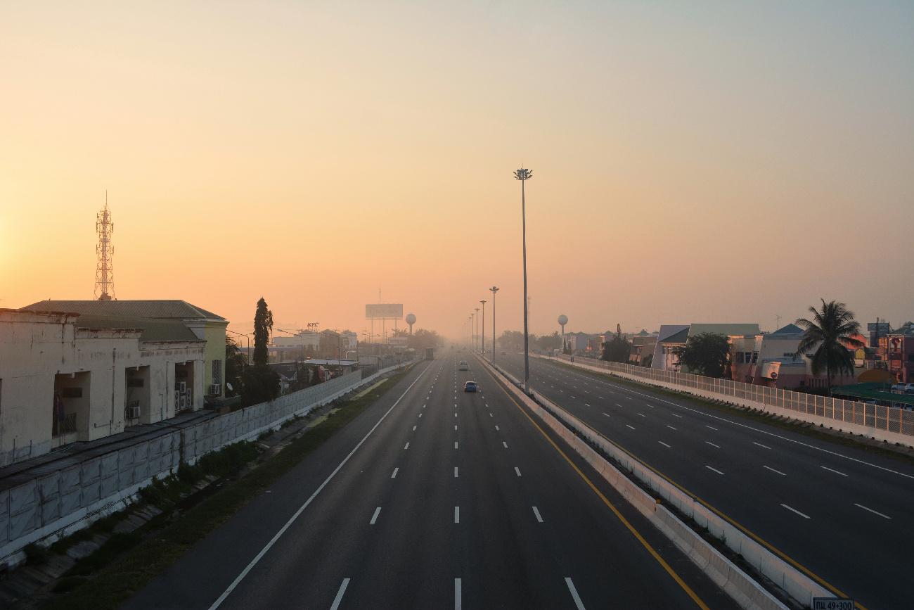 a highway in Thailand with only a few cars