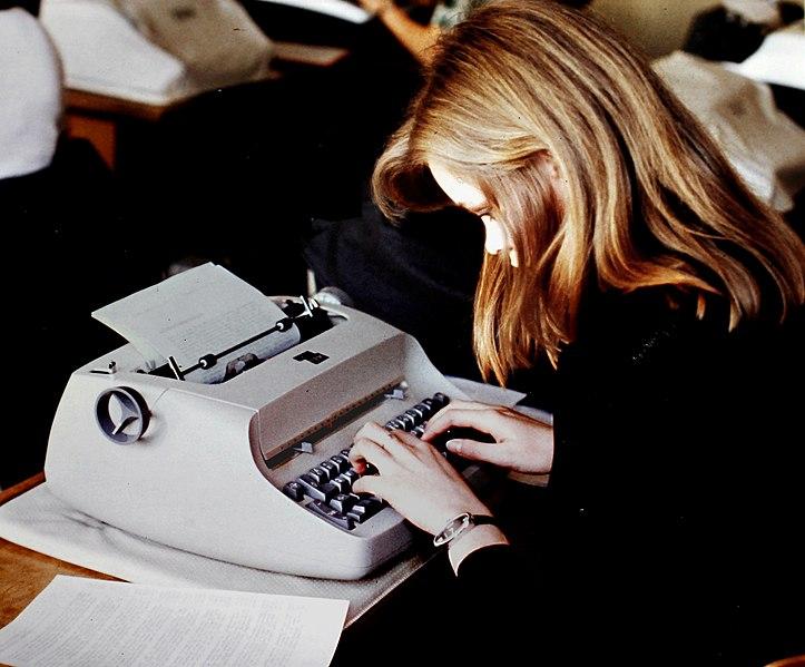 a student undergoing typing training on an IBM Model 72 typewriter