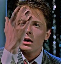 Marty McFly's hand fading away due to a time paradox. Back to the Future (1985)