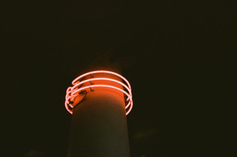 red neon lights wrapped around a column