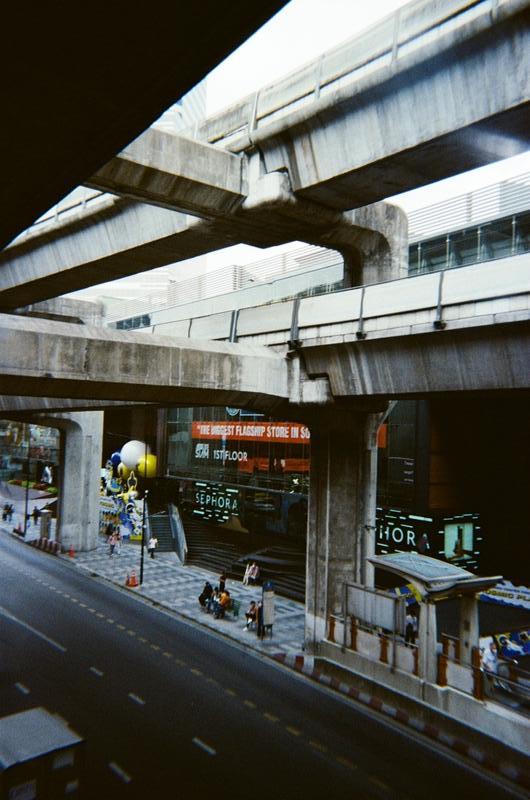 a road beneath the sky train tracks