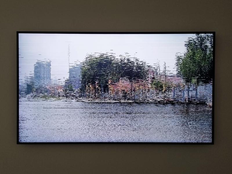 a screen showing a livestream of the Chao Phraya River in Bangkok